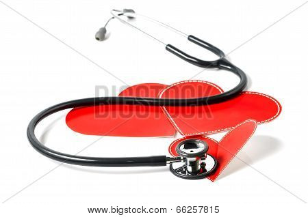 stethoscope and red heartl on white background