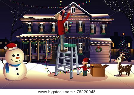 Father Son Putting Up Lights Around The House For Christmas