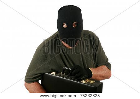 A Genuine Burglar aka Thief or Bad Guy, Robber, Stealer, Masked Man etc. wears a Black Ski Mask to hide his identity as he steals things from unsuspecting people. Isolated on white room for text  