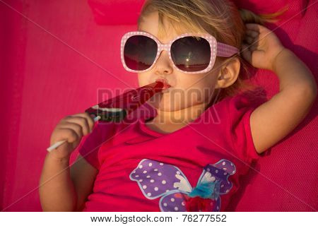 Portrait of cute little girl at tropical beach