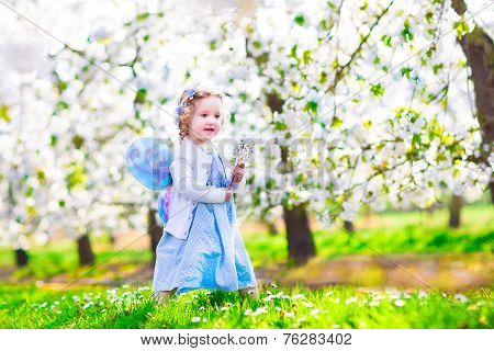 Little Girl In Apple Garden