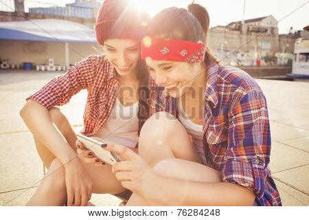 Two Brunette teenage girls friends in hipster outfit
