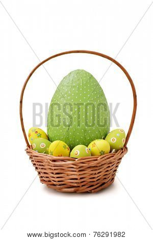 Easter eggs in a basket on white background