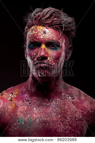 Creepy portrait of a halloween man with bloody body art and face art.
