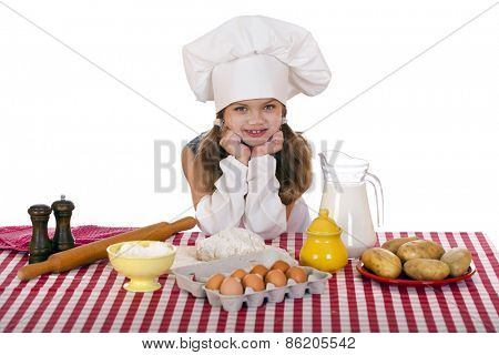 Beautiful little baby dressed as a cook, isolated on a white background