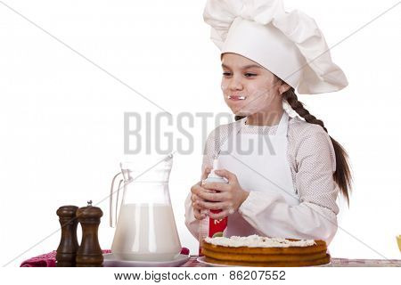 Cooking and people concept - smiling little girl in cook hat, isolated on white background