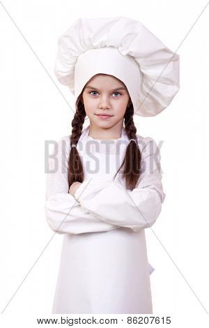 Cooking and people concept - smiling little girl in cook hat, isolated on white background