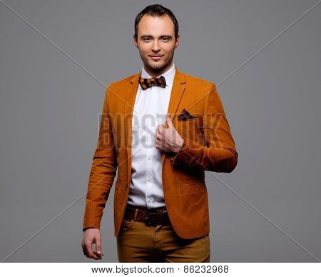 Sharp dressed fashionist wearing jacket and bow tie