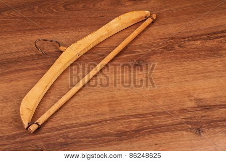 Antique Wooden Clothes Hanger On The Wood