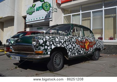 KIEV, UKRAINE - MAR 16: exterior of the vintage Soviet car GAZ-21 Volga with folk stile tuning on March 16, 2015 in Kiev,Ukraine