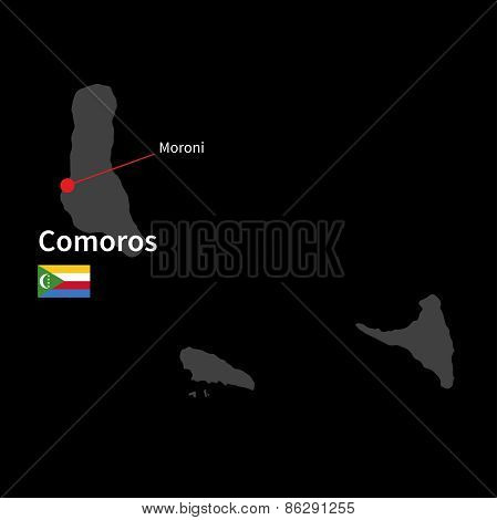 Detailed map of Comoros and capital city Moroni with flag on black background