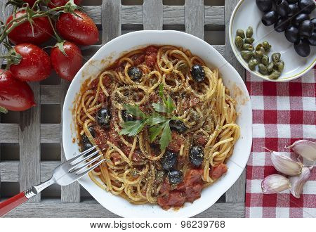Italian Food: Pasta With Tomatoes, Olives And Capers, Called Puttanesca