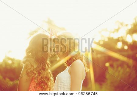 Best Girlfriends Are Looking Into Each Others Eyes. Sunset.