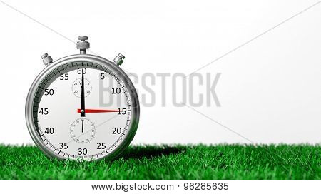 Silver chronometer on green grass, isolated on white