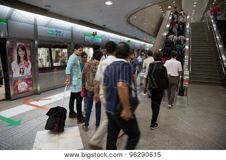 SINGAPORE - CIRCA FEBRUARY, 2015: People Bugis MRT station in Singapore. MRT is a rapid transit system forming the major component of the railway system in Singapore.