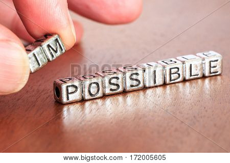 Impossible Possible Business Letters Placed On A Desk In Precious Wood