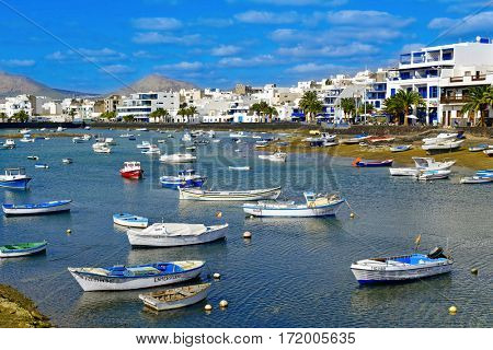 ARRECIFE, SPAIN - NOVEMBER 11, 2016: A view of the bay Charco de San Gines and its characteristics fishing boats in Arrecife, Lanzarote, in the Canary Islands, Spain
