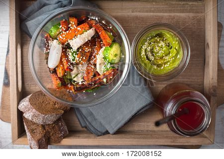 Vegetable salad avocado sauce and cranberry drink horizontal