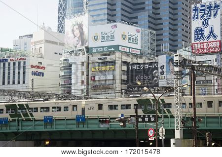 Cityscape And Jr Yamanote Line Of Train Tokyo Metro With Traffic Road At Shinjuku