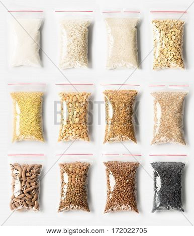 Set Of Plastic Transparent Zipper Bags With Full Of Premium Groats Isolated On White, Vacuum Package