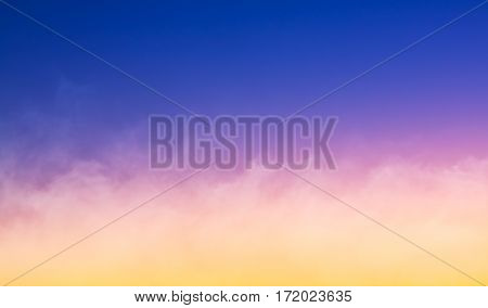 A fog cloudbank at sunset featuring a colorful gradient. Made with a slightly long exposure for a soft focus effect.