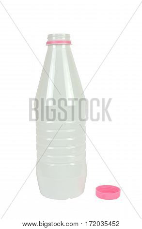 White opened plastic bottle for milk or milky drinks with its pink lid beside isolated on white