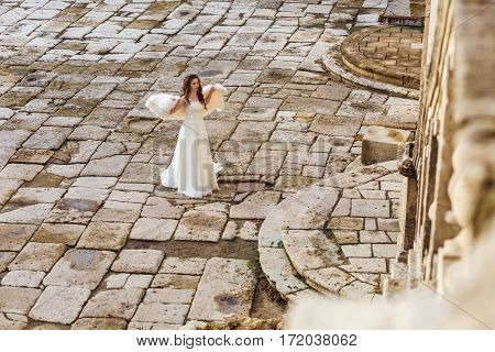 Romantic brunette bride in the old town