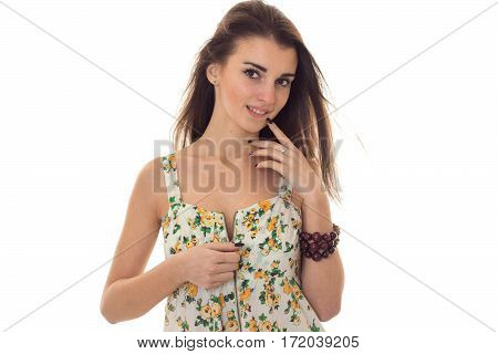adorable young brunette woman take off her sarafan with floral pattern and seduce on camera isolated on white