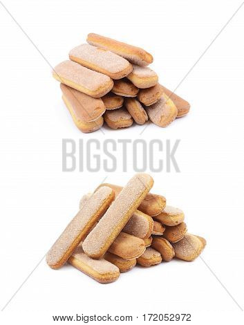 Pile of multiple ladyfinger savoiardi biscuit cookies, composition isolated over the white background, set of two different foreshortenings