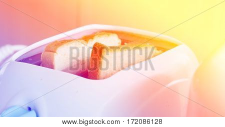 Close up of toaster with bread slices