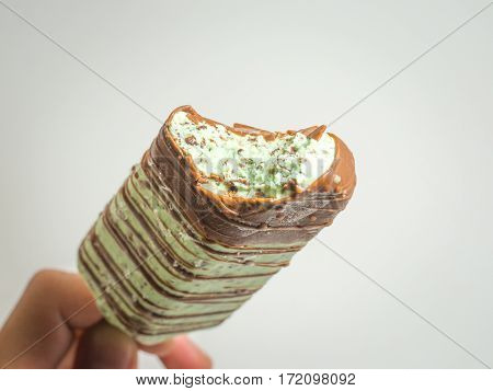 this blue mint milk ice cream stick covered with chocolate