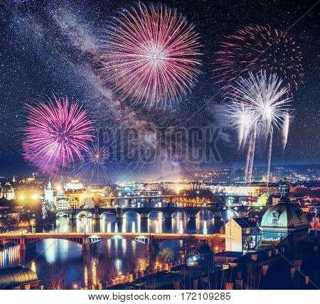 beautiful houses Czech Republic. Photo greeting card. Bokeh light effect, soft filter. Colorful fireworks on the black sky background