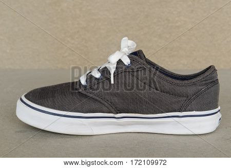 close up vintage style of sport gray sneaker shoe on white gray background