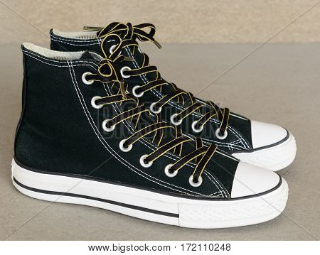 close up vintage style of sport black sneaker shoe on white background
