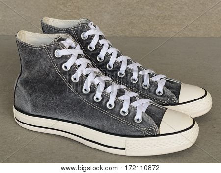 close up vintage style of sport gray sneaker shoes on white background