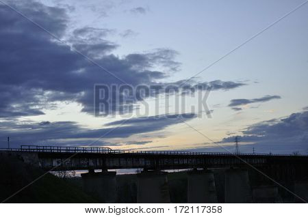 2017 Fresno, California: Sunset view of railroad tracks over San Joaquin River