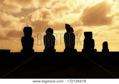 Long shot of the Moai during sunset at Ahu Tahai in Hanga Roa in Rapa Nui Easter Island Chile South America