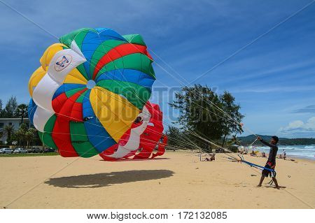 People Playing Parasailing In Phuket, Thailand