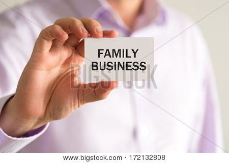 Businessman Holding Card With Text Family Business