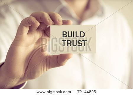 Businessman Holding Build Trust Message Card