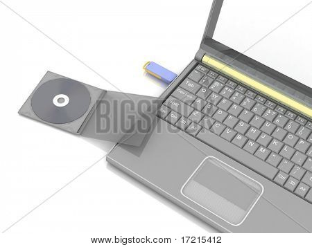 Foto stock: CD se encuentra al lado de un cuaderno en el que el pendrive insertado. aislado en blanco