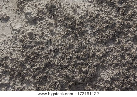 White arid cracked rough lumpy dry textured desert soil