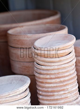 Piles of crocks made of terracotta used by the gardener