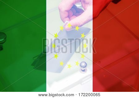 Hand putting ballot in the box with Italy flag and yellow stars. Italian referendum on leaving the European Union