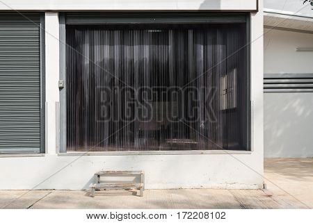 Factory Gate with Transparent Plastic Curtain .
