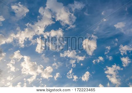 clouds in the form of bizarre shapes on a bright blue sky