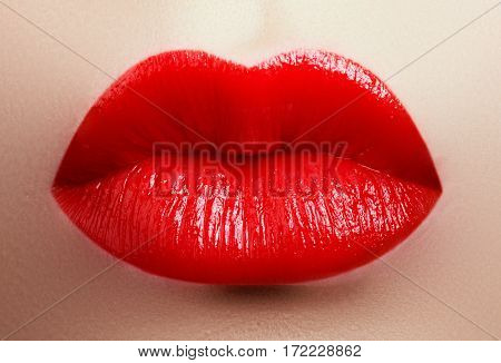 Cosmetics And Makeup. Red Lip Gloss And Lipstick. Fashion Lip Makeup. Sensual Female Mouth. Closeup
