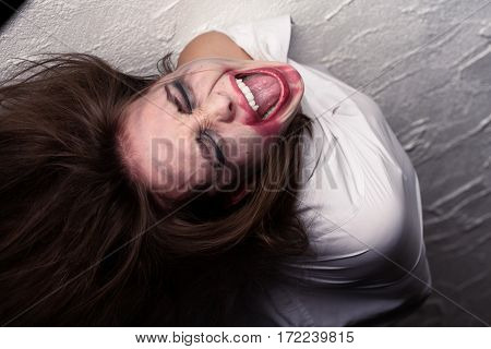 screaming fun crazy woman vampire in straitjacket