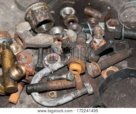 Old corroded components screws and nuts for vintage tractor