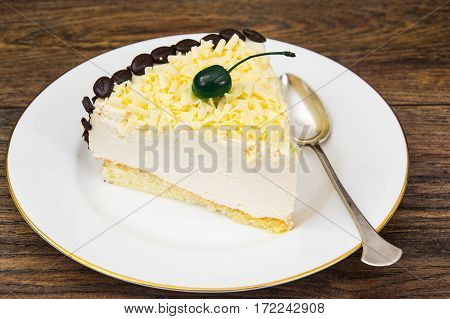 Cake piece Pigeon milk on plate. Stdio Photo